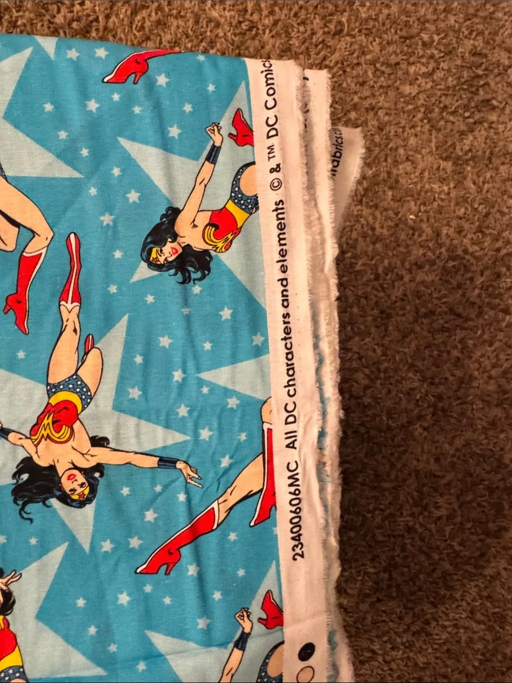 Fabric Wonder Woman Teal/Blue Background. 3 Yards x 44/45” Wide. DC Comics